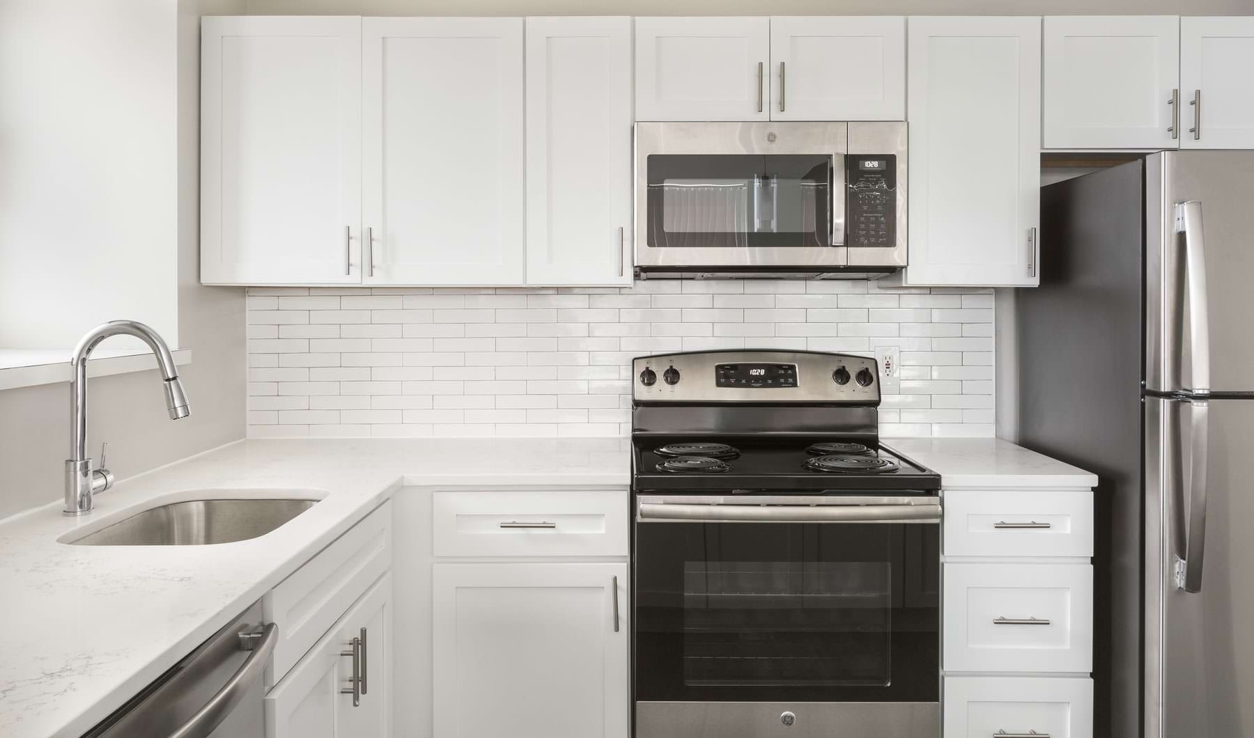 A kitchen with white cabinet and sink of an apartment in Haverhill, MA A kitchen with white cabinet and sink of an apartment in Haverhill, MA